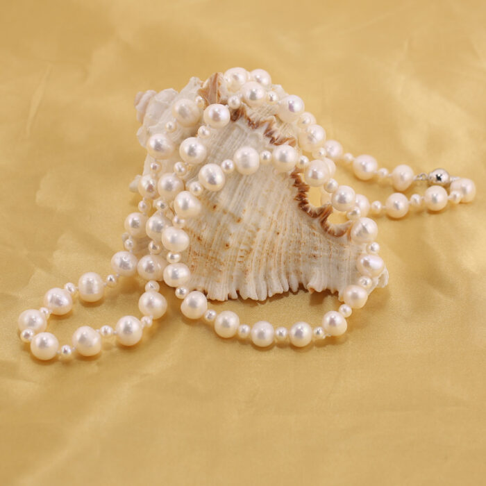 Layered pearl necklace with charm